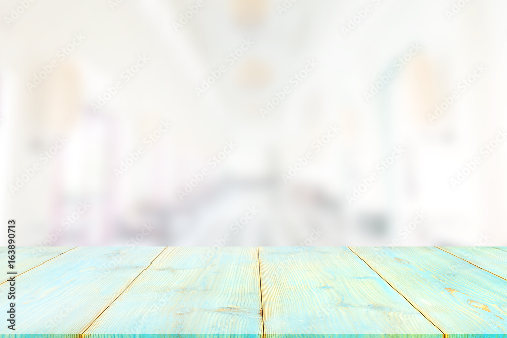Wood table top on blurred abstract background from building hallway,for display or montage your products Wood table top on blurred abstract background from building hallway,for display or montage your products