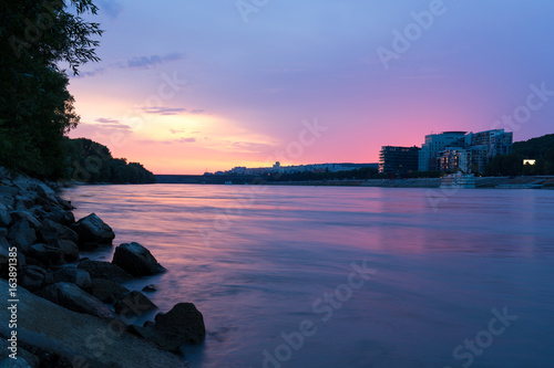 Bratislava, sunset over river Danube with River Park and Lafranconi Bridge