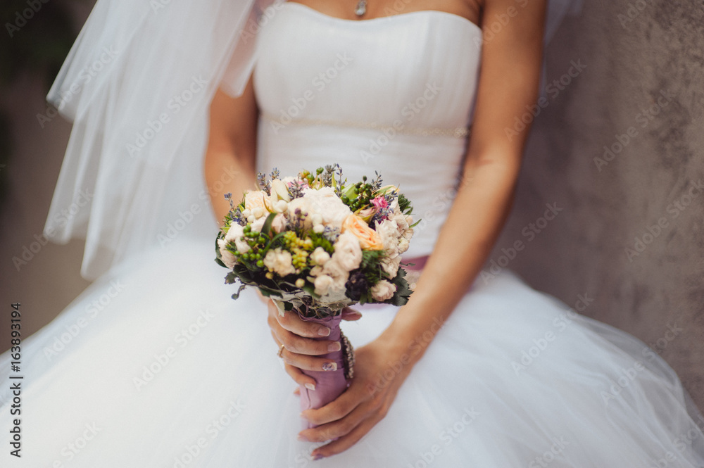 Bride holding big wedding bouquet on wedding ceremony Bride holding big wedding bouquet on wedding ceremony