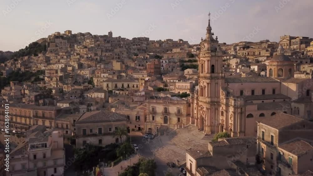 sunset flying past San Giorgio cathedral in Modica sunset flying past San Giorgio cathedral in Modica