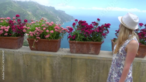 young blonde woman walking in Ravello at Italy