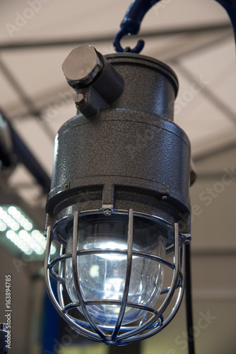 Industrial explosion-proof lantern shines with white light at coal mining exhibition © Oksana Bessonova