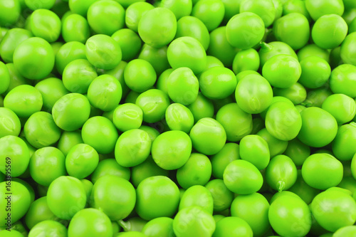 Fresh green peas as background © Africa Studio