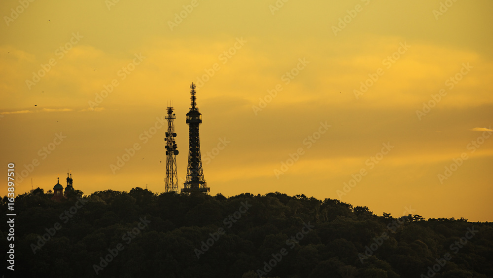 Obraz premium Silhouette Petrin Tower. Prague, Czech Republic. Silhouettes of towers and castle.