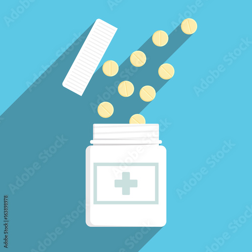 yellow medicine tablet come out off white plastic bottle on blue background