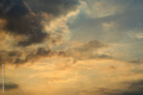 Clouds with light rain, the sun is about to fall evening. © MAGNIFIER