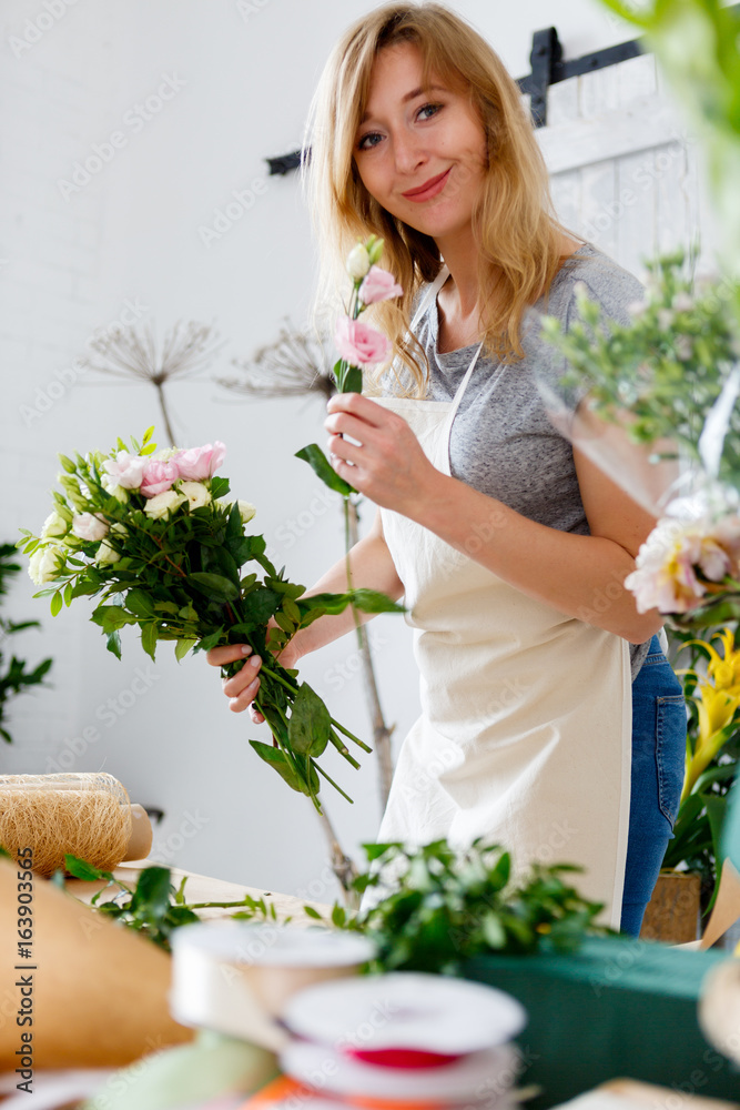 Smiling florist in flower shop