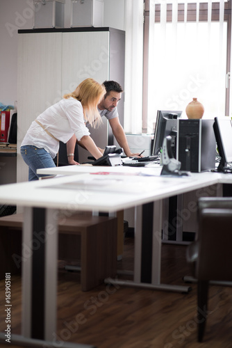 designers in office at the wooden furniture manufacture