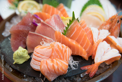 sashimi set with different fresh fish sliced on plate