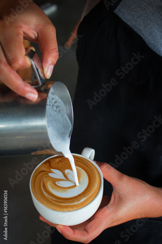 Coffee latte art , pouring milk desing