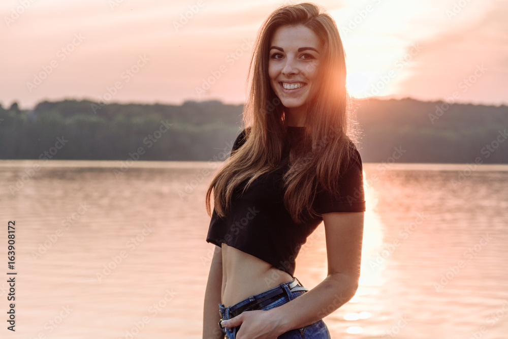 Summer spring portrait of young beautiful woman smile in the park sunset Summer spring portrait of young beautiful woman smile in the park sunset