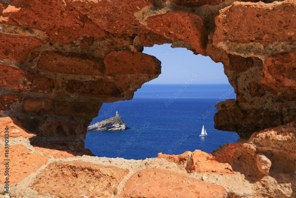 sea view through hole in the wall