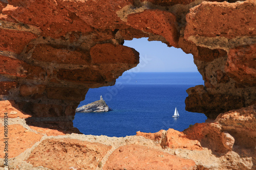 sea view through hole in the wall