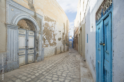 street with old wooden doors in Tunisia © sergejson