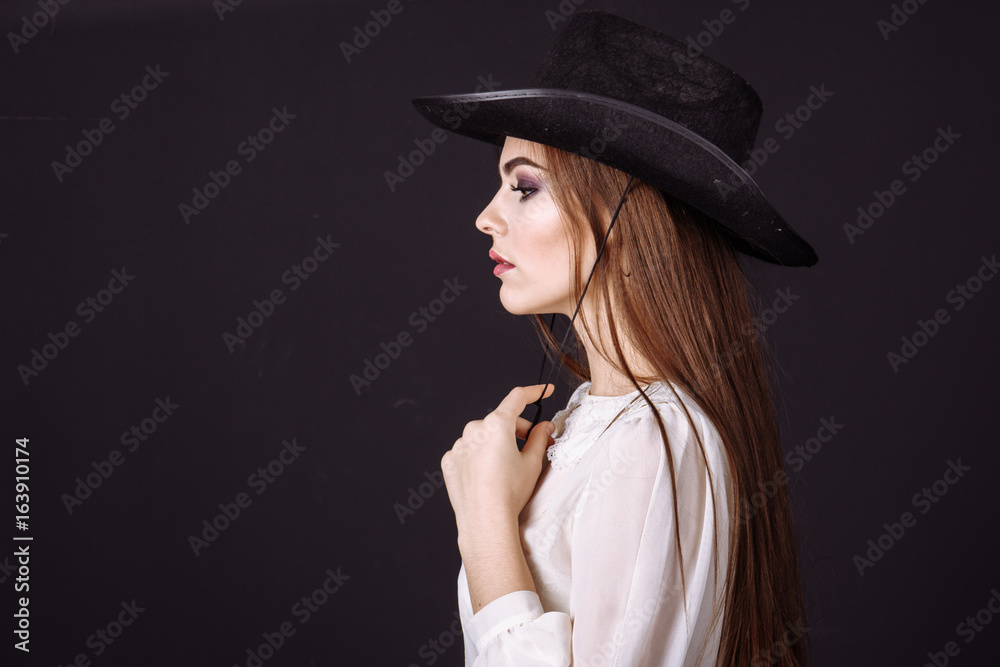 Portrait of a beautiful woman in cowboy's hat Portrait of a beautiful woman in cowboy's hat