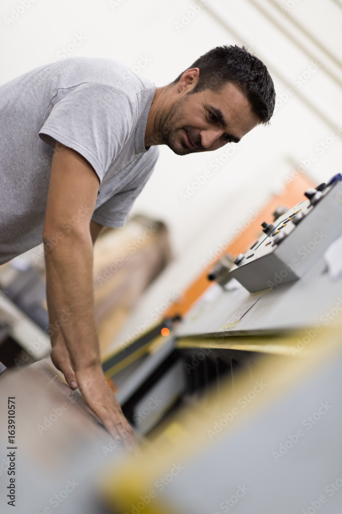 worker in a factory of wooden furniture worker in a factory of wooden furniture