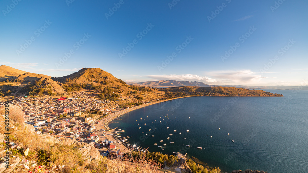 Panoramic view of Copacabana Bay on Titicaca Lake from the summit of Mount Calvario (3966 m), among the most important travel destination in Bolivia. Panoramic view of Copacabana Bay on Titicaca Lake from the summit of Mount Calvario (3966 m), among the most important travel destination in Bolivia.
