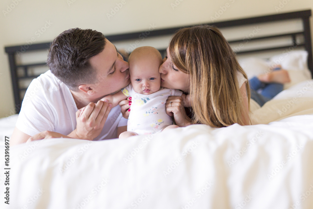 Portrait of parent with her 3 month old baby in bedroom Portrait of parent with her 3 month old baby in bedroom