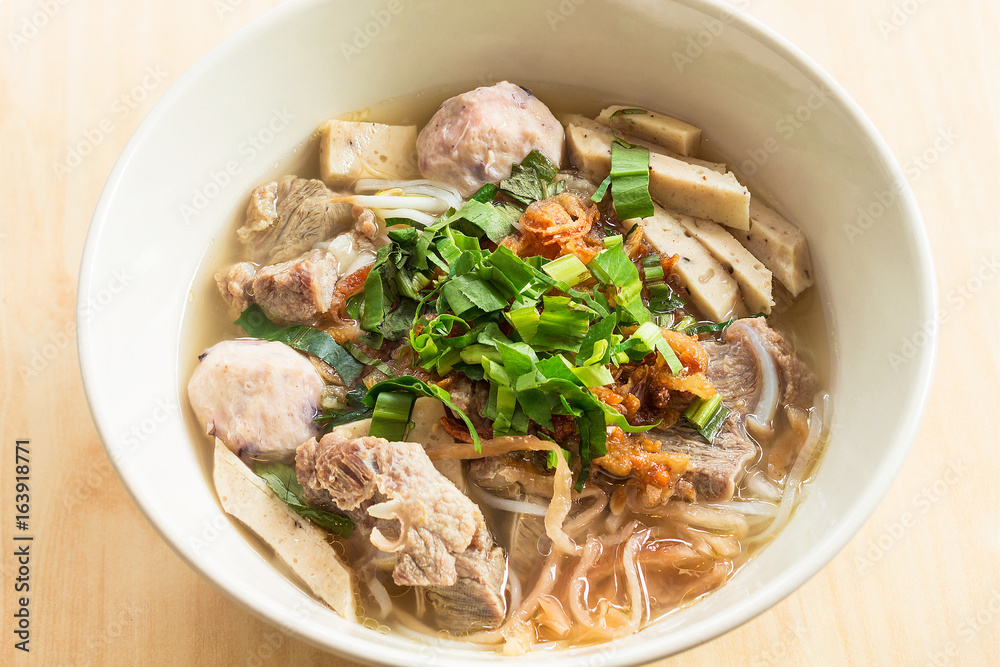 Vietnamese soup Pho Bo with vegetables and rice noodles in a bowl Vietnamese soup Pho Bo with vegetables and rice noodles in a bowl