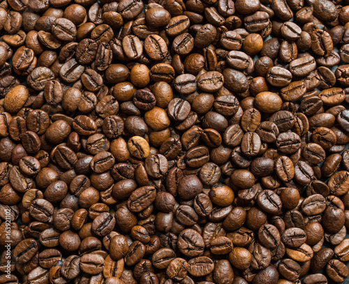 Roasted coffee beans on dark background. Selective focus.