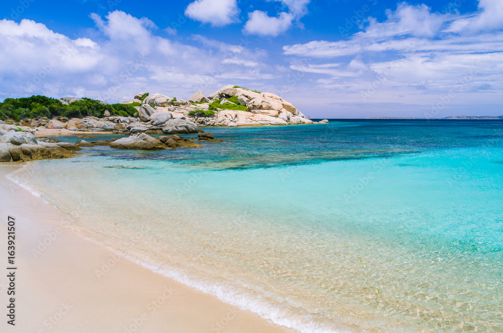 Azure beach with clear water near Porto Pollo on beautiful Sardinia island, Italy