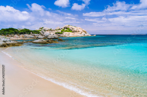 Azure beach with clear water near Porto Pollo on beautiful Sardinia island, Italy