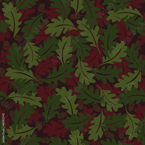Seamless pattern. Autumn background. Green and brown oak leaves. It can be used for printing on fabric, wallpaper, design and wrapping