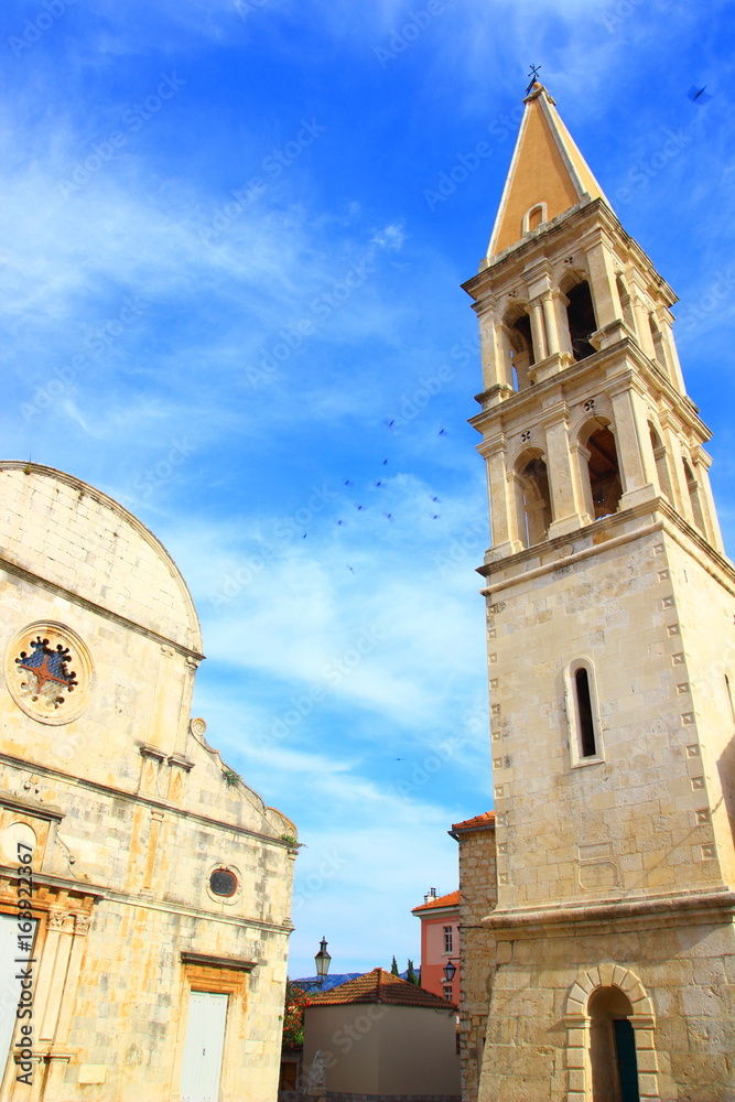 Fototapeta premium Church and bell tower in Stari Grad, Island Hvar, Croatia