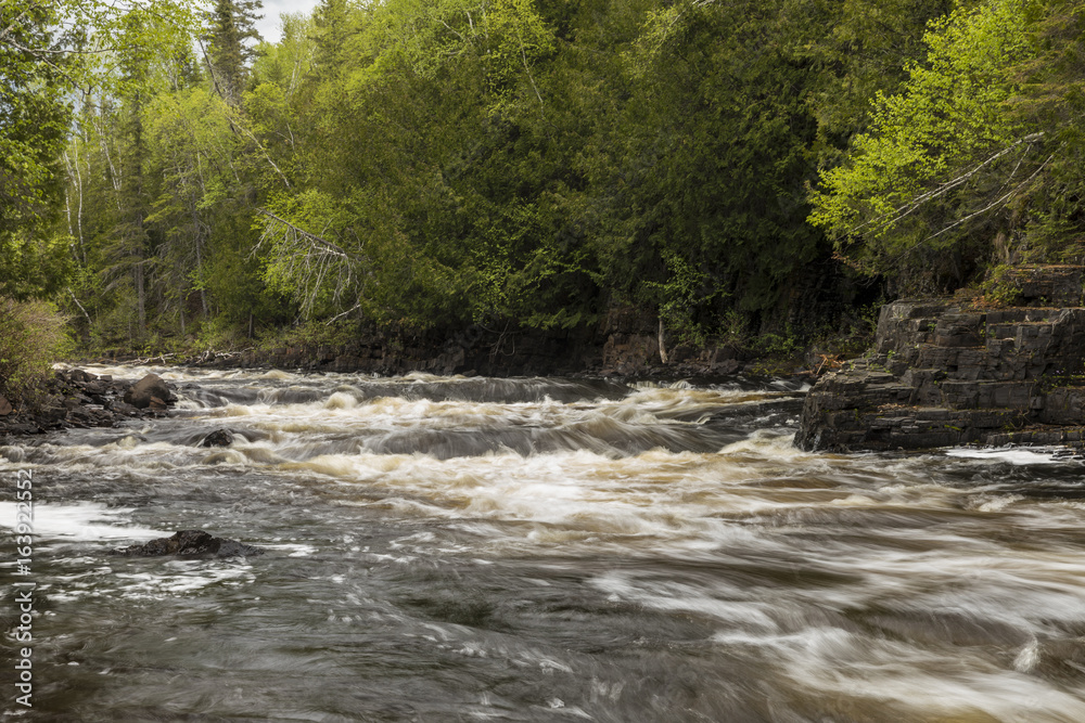 Fototapeta premium Current River Cascades / A river with cascading rapids in Ontario Canada.