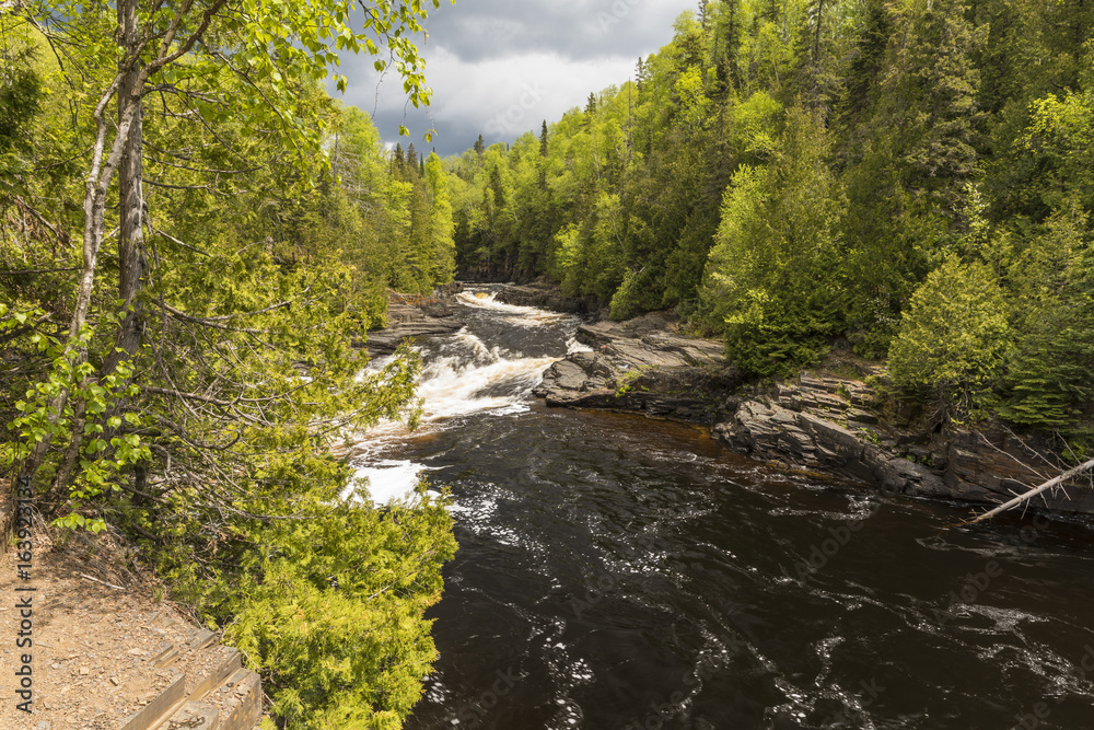 Current River Cascades / A river with cascading rapids in Ontario Canada. Current River Cascades / A river with cascading rapids in Ontario Canada.
