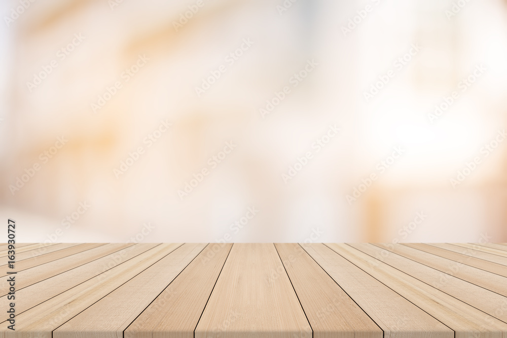 Wood table top on blurred background from building,for montage your products Wood table top on blurred background from building,for montage your products