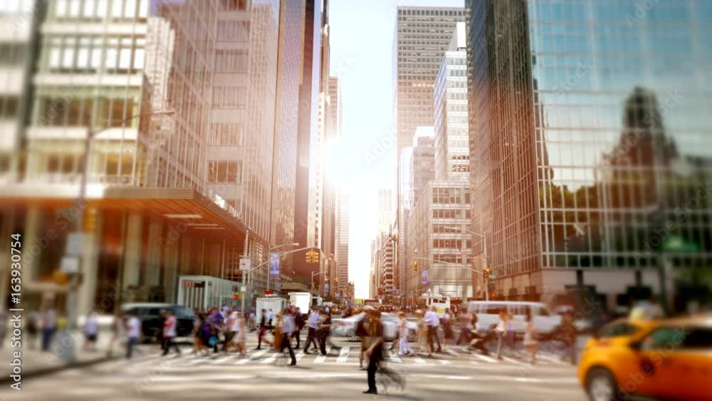 crowd of people walking in the city commuting through business district