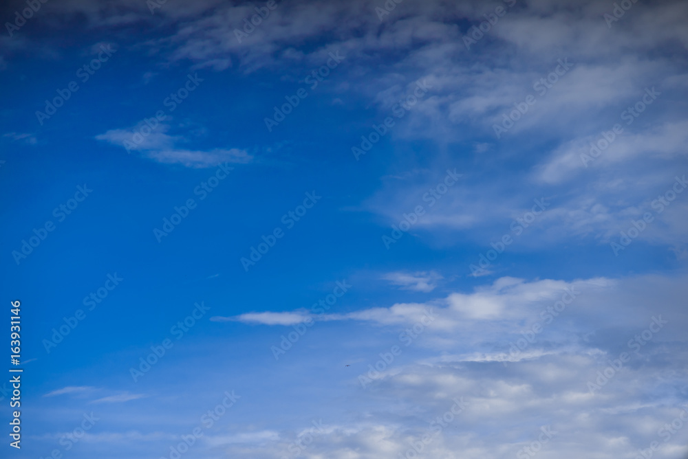 Blue sky and thin clouds background