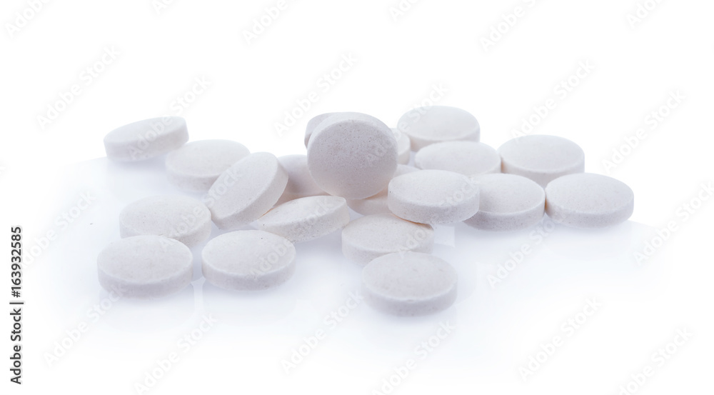 white pills isolated on white background