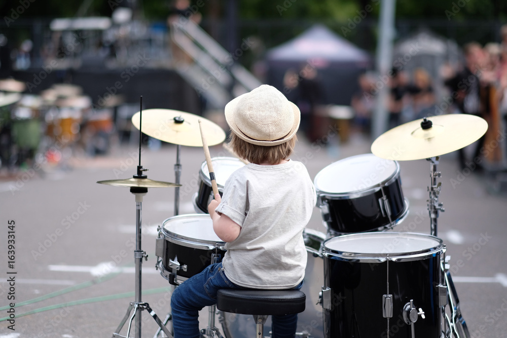 Obraz premium A little musician behind the drum set. Baltic Drum Summit 2017. Riga, Latvia.