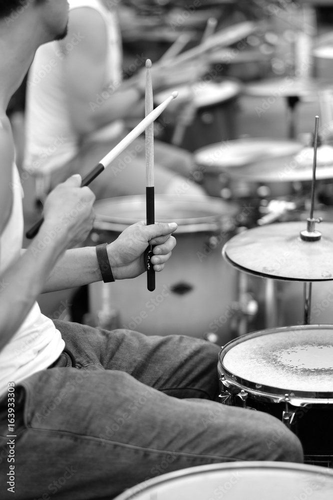 Fototapeta premium The drummer's hands with a stick behind the drum set. Baltic Drum Summit 2017. Riga, Latvia.