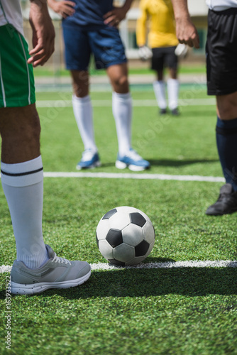 partial view of group of soccer players during soccer match on pitch © LIGHTFIELD STUDIOS