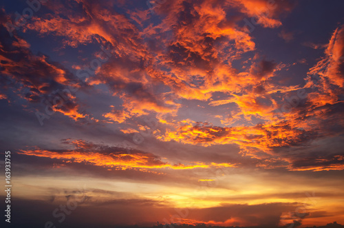 Sunset makes the sky and cloud  a beautiful golden yellow.