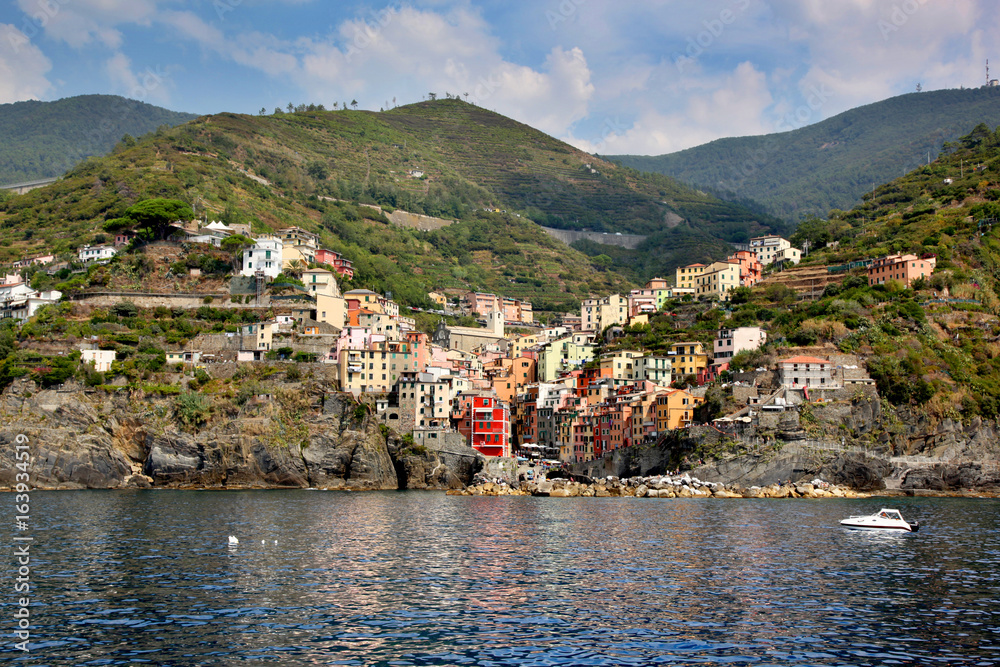 View of colorful Riomaggiore from the water in the Cinque Terre