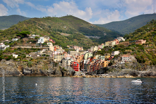 View of colorful Riomaggiore from the water in the Cinque Terre