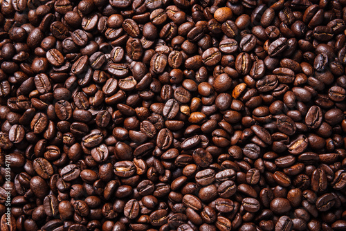 Texture of roasted ready to drink coffee close-up.Coffee Bean Scene.BlackGround Coffee.