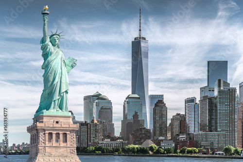 The statue of Liberty with World Trade Center background  Landmarks of New York City  USA