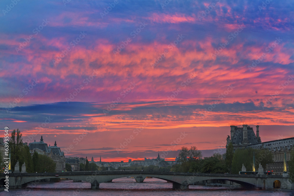 The sun setting over the River Seine