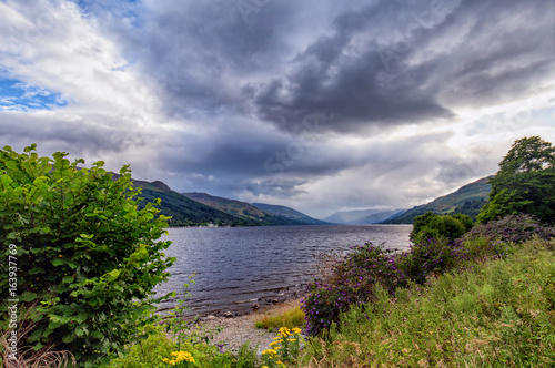  Dramatic summer clouds gathering over Loch Earn in the highlands of Scotland.