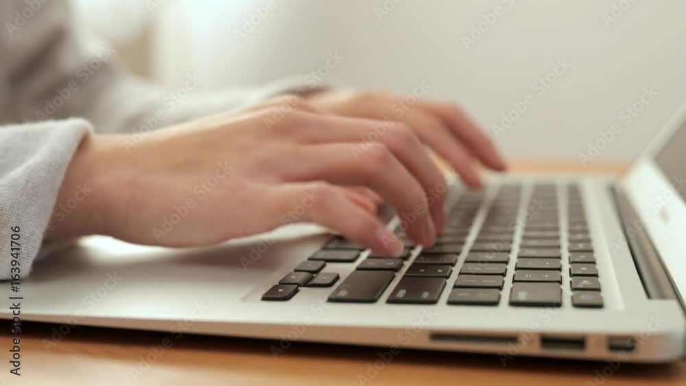 Woman working on laptop computer Woman working on laptop computer