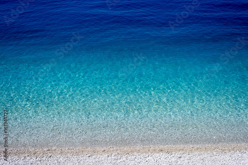 beautiful beach with crystal clear turquoise water, top view of the sea