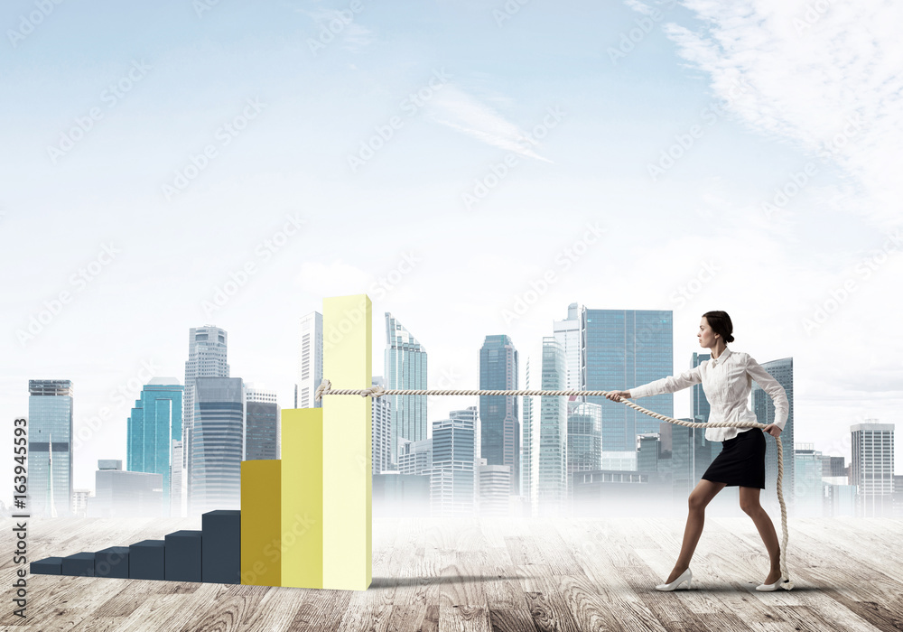 Businesswoman pulling arrow with rope and making it raise up Businesswoman pulling arrow with rope and making it raise up
