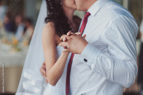 Wedding couple on a walk bride and groom sea field sunset architecture grass sand