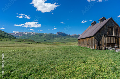 Barn overlooking meadow in high Rocky Mountains