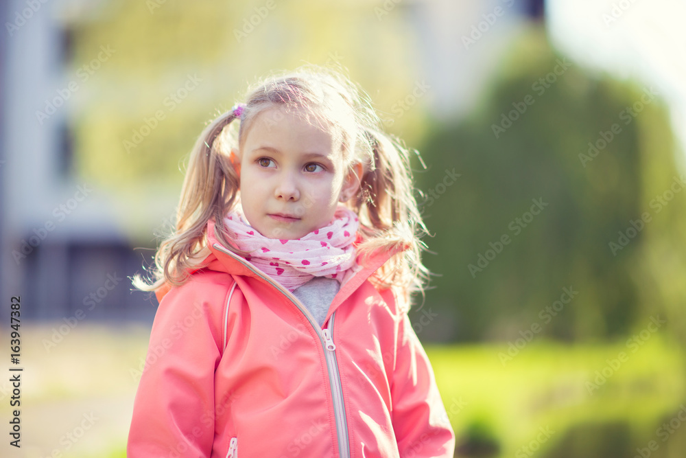 Portrait of pretty school girl in sunny park Portrait of pretty school girl in sunny park